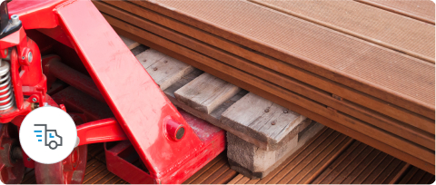 A pile of wooden floor planks on a forklift.