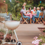 Wooden patio in the garden with a grill